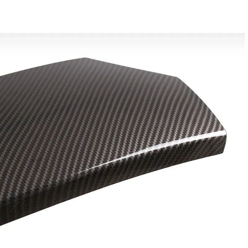 Set of three black ABS plastic armrest box covers with a shiny diagonal carbon fibre weave pattern.