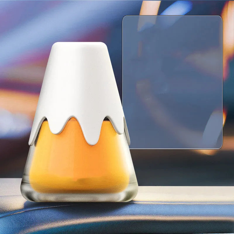 Glass jar car aromatherapy diffuser with Snow Mountain fragrance cream, shown in purple colour option.