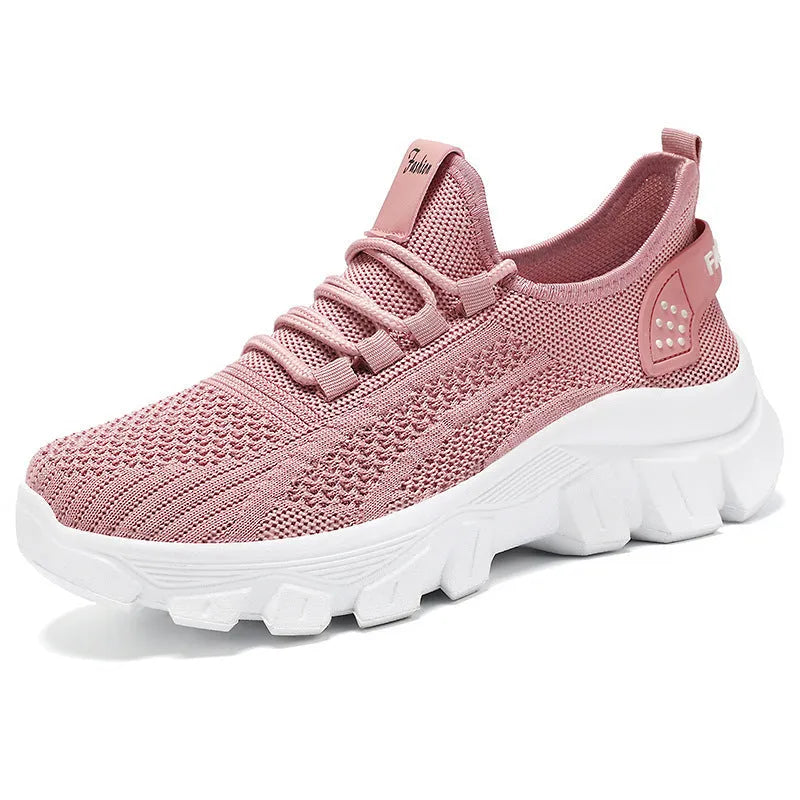 Women's white flyknit sneakers with round toe and flat PVC sole