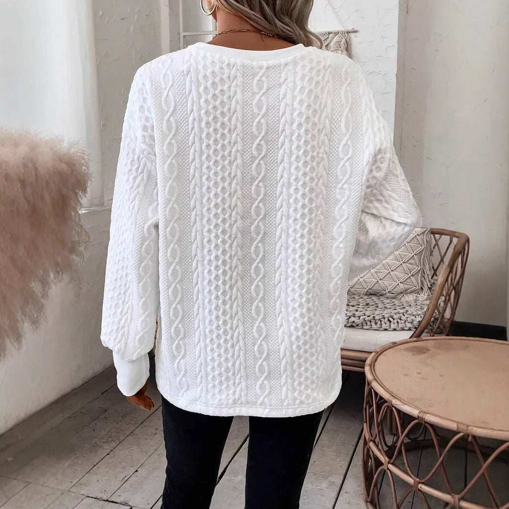 Milky white loose fit long sleeve T-shirt with 3D pattern detail on mannequin