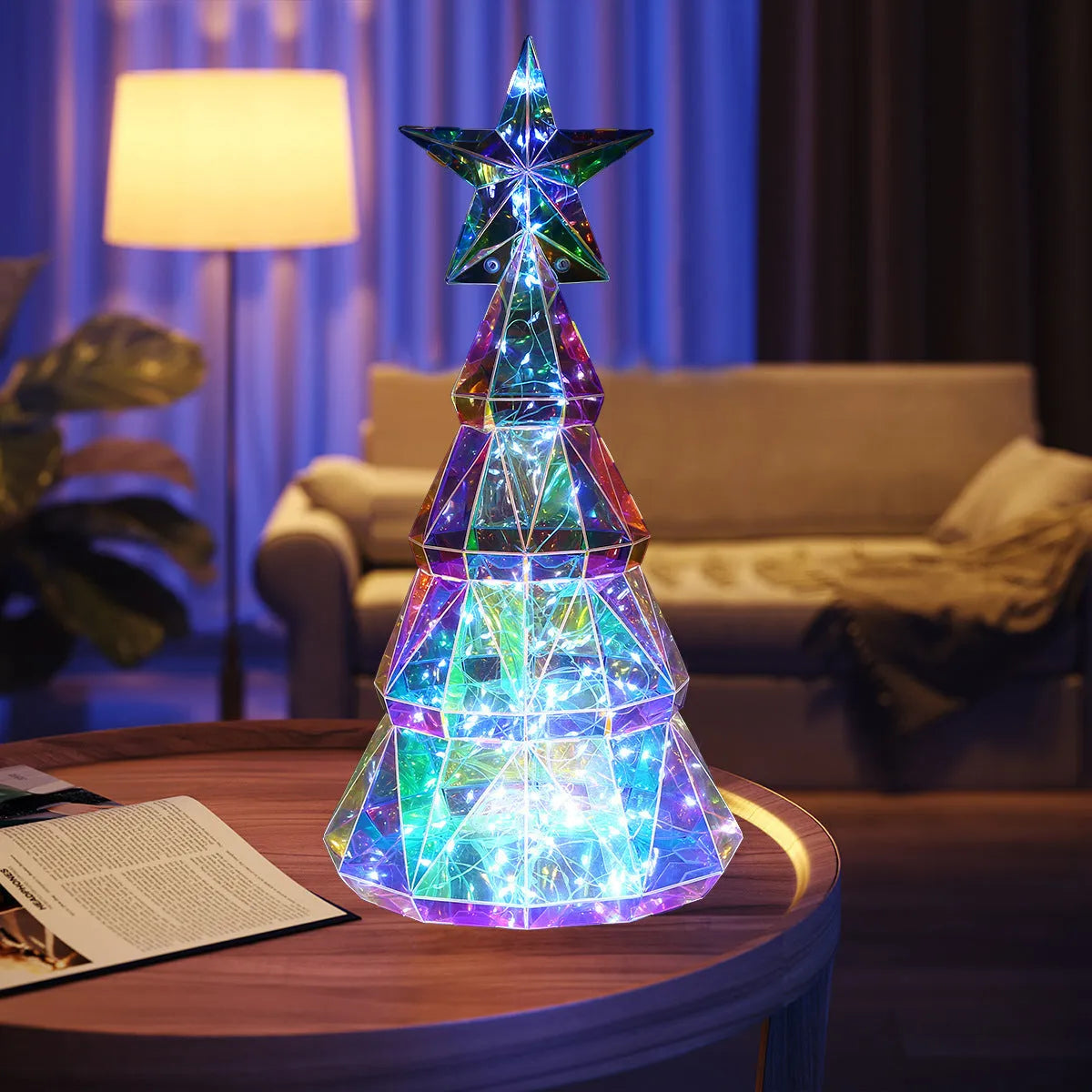 Colourful cartoon-style LED Christmas tree decorative toy on a tabletop