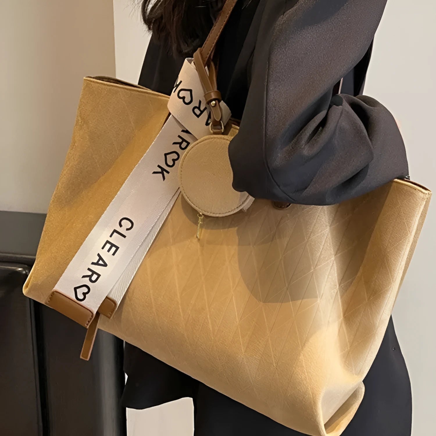 Soft green polyester large shoulder tote bag with horizontal square shape and a shoulder strap.