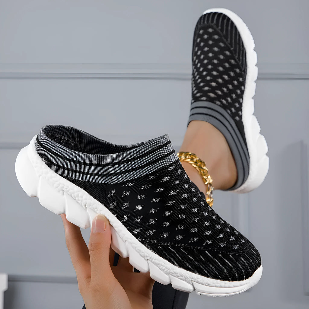 Women's Flyknit semi-slipper casual shoes in striped pattern with hollowed-out details, shown in black, pink, and purple.