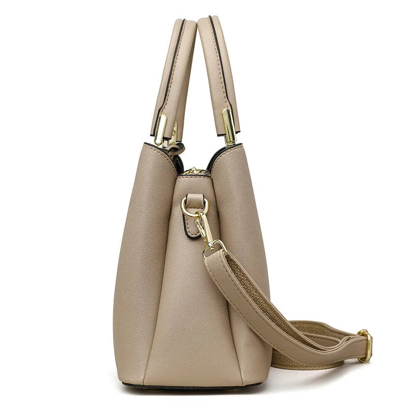 Women's black PU leather messenger bag with shoulder strap and sewing thread detailing