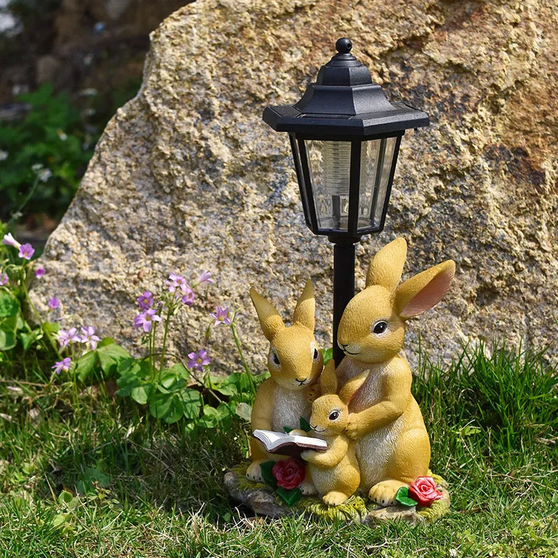 Hexagonal solar garden lamp with synthetic resin construction showing animal figurine design options