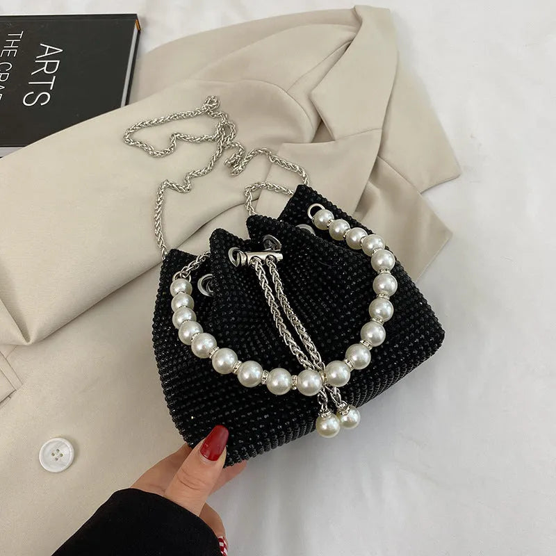 Soft PU leather crossbody bag with diamond embellishments and chain strap in bucket shape