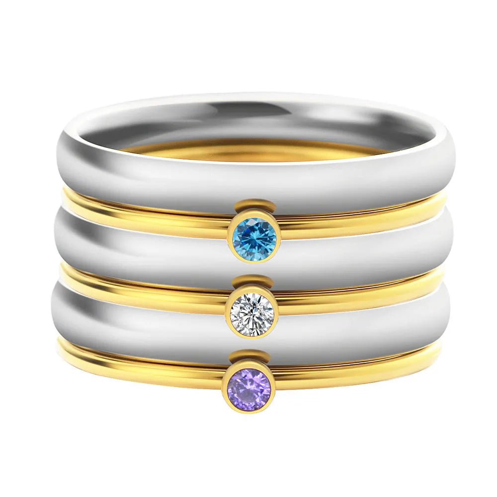 A geometric engraved titanium steel ring featuring a December birthstone colour.