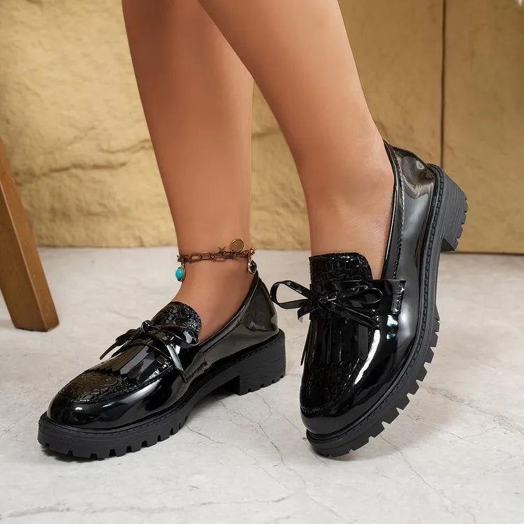 Women's brown loafers with decorative bow detail on artificial PU upper