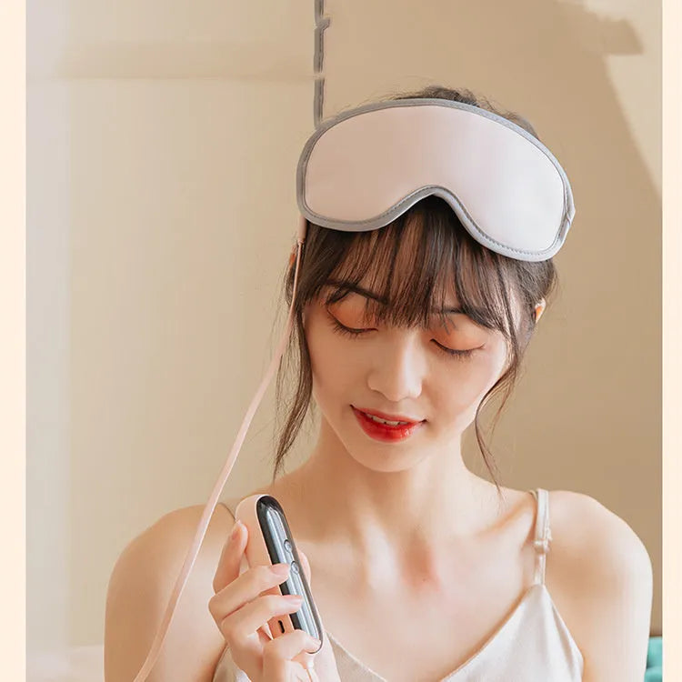 Green portable eye SPA mask showing suede shell and contoured shape for steam heat and vibration massage.