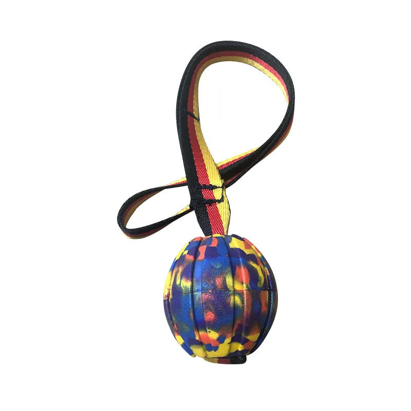 EVA floating dog training ball in camouflage colour and yellow, shown in 65mm, 7cm, and 9cm diameter sizes.