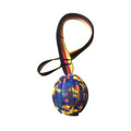 EVA floating dog training ball in camouflage colour and yellow, shown in 65mm, 7cm, and 9cm diameter sizes.