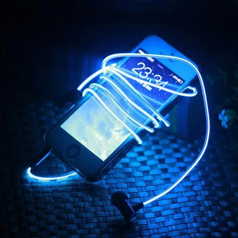 Magic Light LED Earphones with illuminated cable and aluminium alloy earpieces in blue, green, or pink.