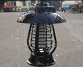 White and purple solar-powered electronic mosquito lamp for outdoor garden use.