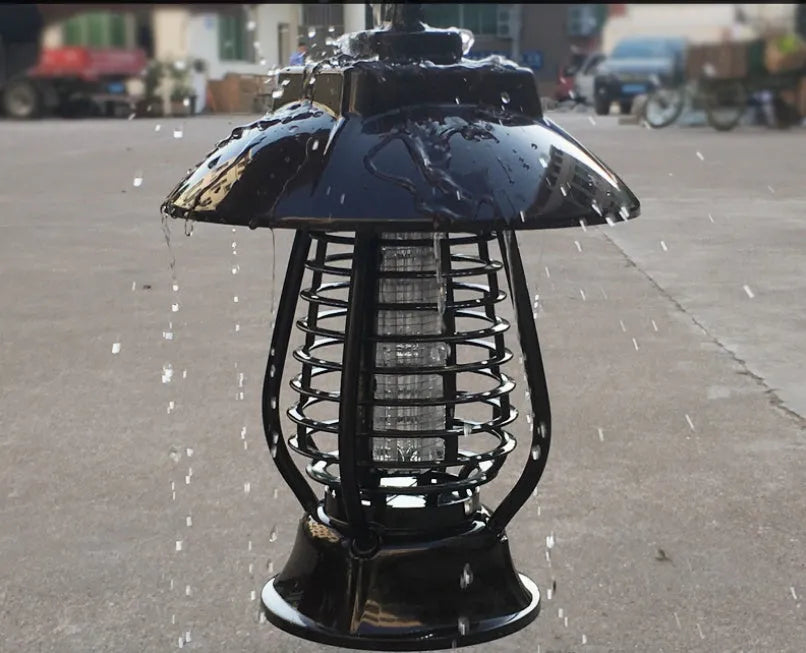 White and purple solar-powered electronic mosquito lamp for outdoor garden use.