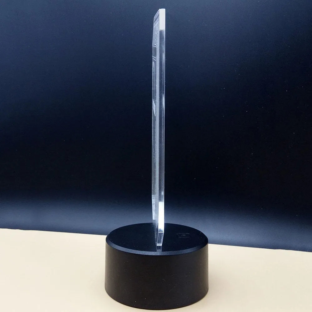 3D brain illusion desk lamp with colour-changing LED lights and remote control on wooden surface