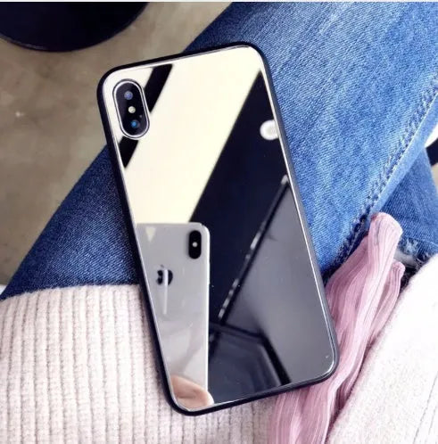 Black clear glass iPhone mirror phone case showing reflective surface and iPhone compatibility