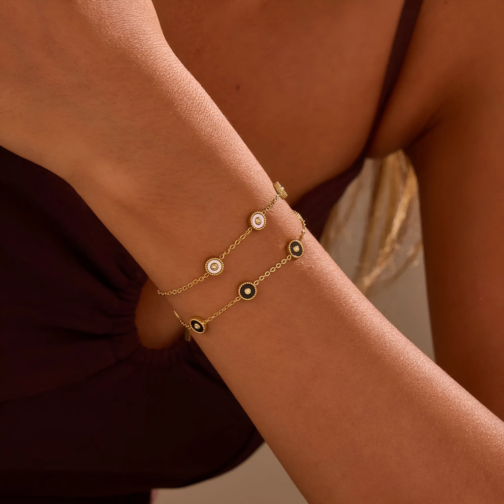 Geometric fritillary pattern stainless steel bracelet with 18K gold plating and matching necklace