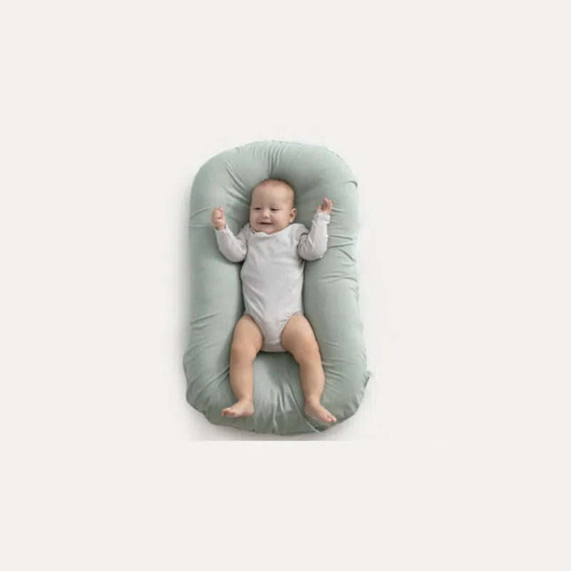 Portable baby nest crib measuring 75x45cm in cotton fabric with PP cotton filler