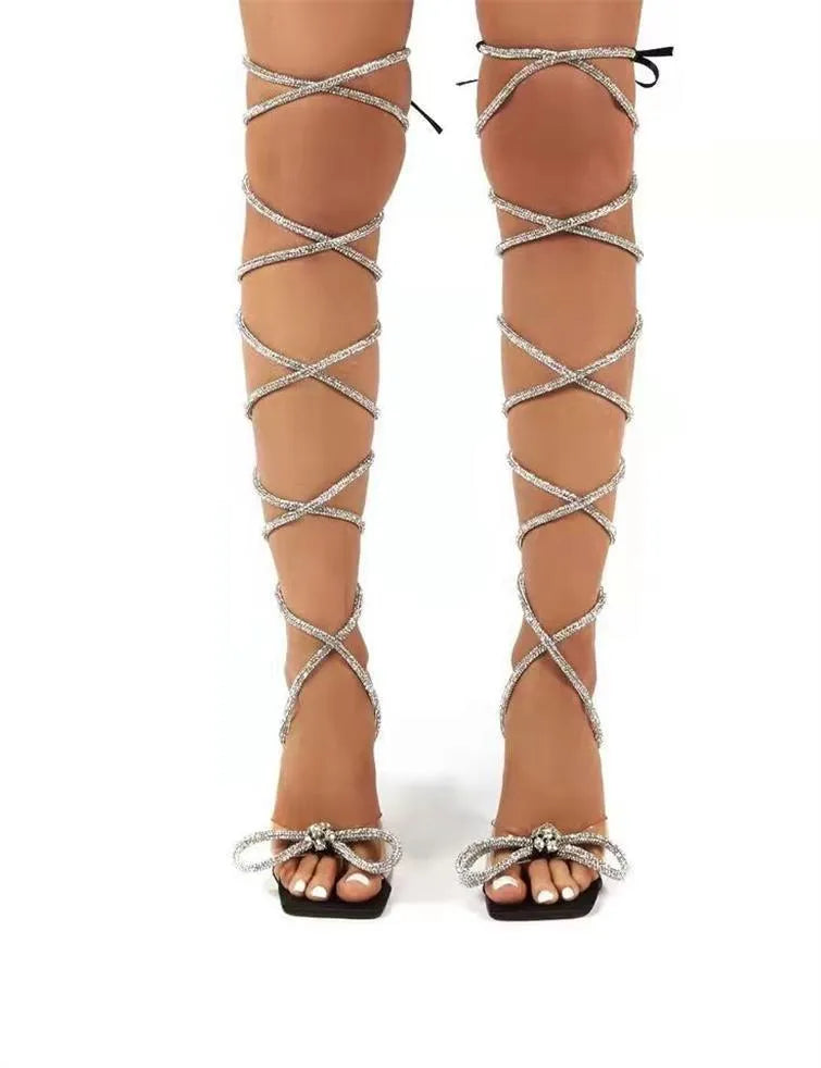 Plus size women's black sandals with sparkling Roman rhinestone straps and a square toe shape