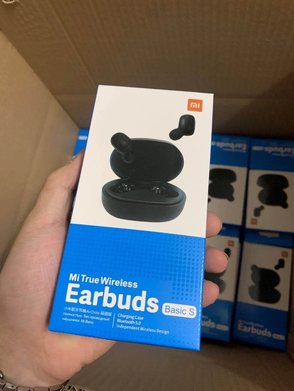 Redmi AirDots black true wireless Bluetooth headphones with charging case.