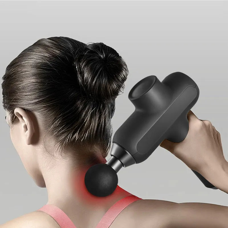 Handheld black muscle massager with six different coloured attachment heads on a white background.