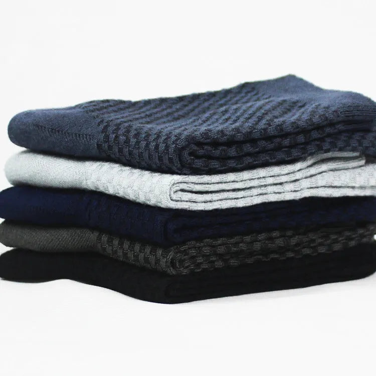 Men's bamboo fibre business socks in small square pattern, shown in classic colours on a grey background.