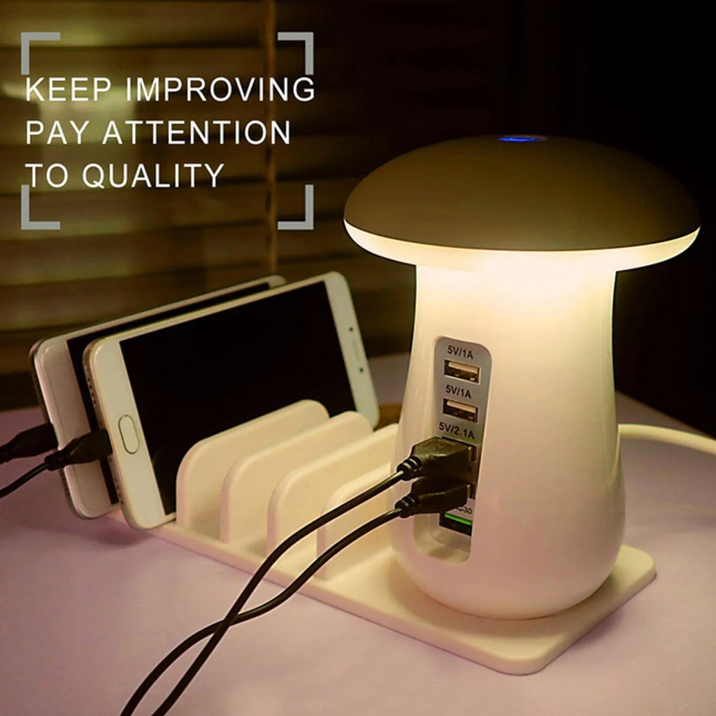 White mushroom-shaped LED desk lamp with 5 USB charging ports on a wooden desk