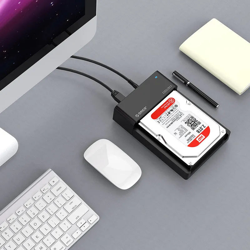 Black plastic hard disk enclosure for 2.5-inch and 3.5-inch SATA drives with USB cable
