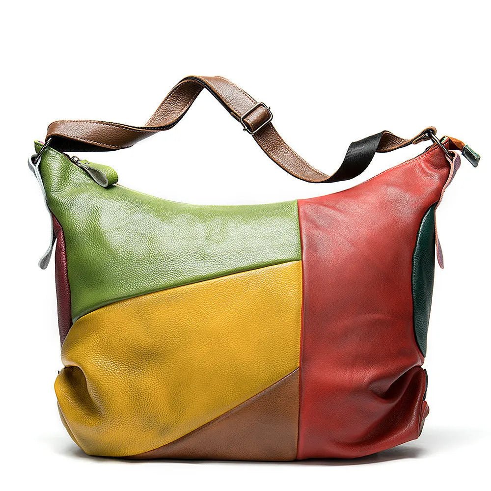 Brown cowhide leather travel bag with dimensions 48cm by 15cm by 37cm, shown as a crossbody or shoulder bag.