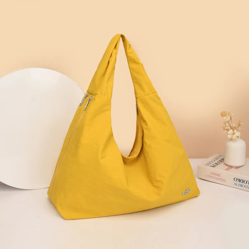 Women's heart-shaped nylon underarm bag in black, yellow, khaki and blue colours with large capacity