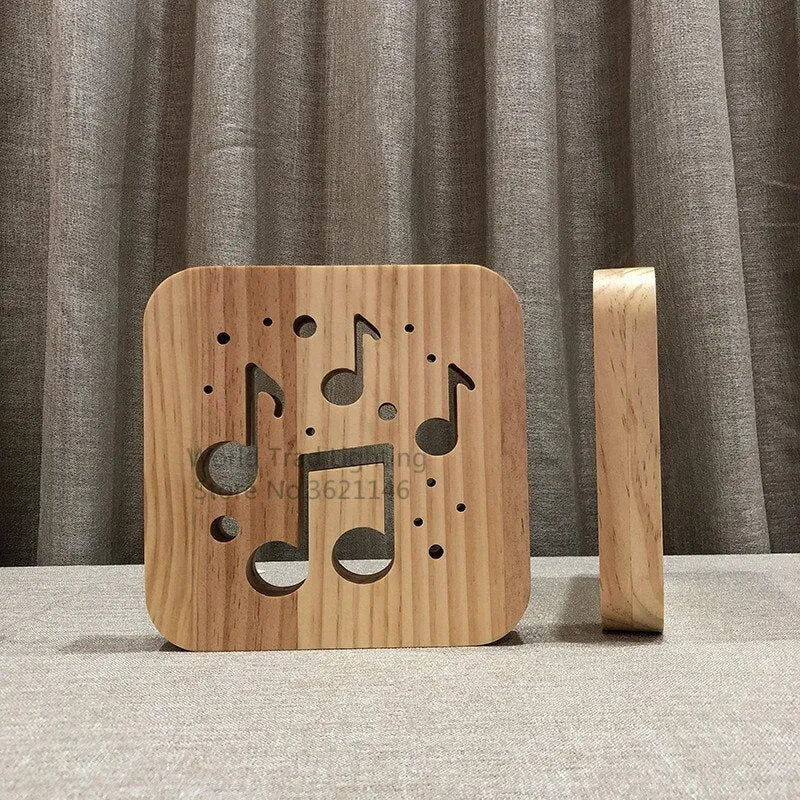 Square wooden USB LED atmosphere light with laser-cut design glowing warm white.