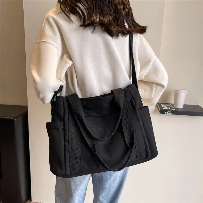 Polyester shoulder bag for women with phone compartment and sandwich pockets in solid colour options