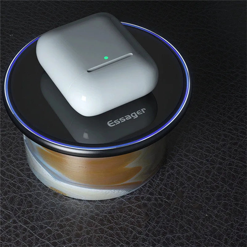 Black aluminium wireless charging pad with LED indicator light on smooth surface