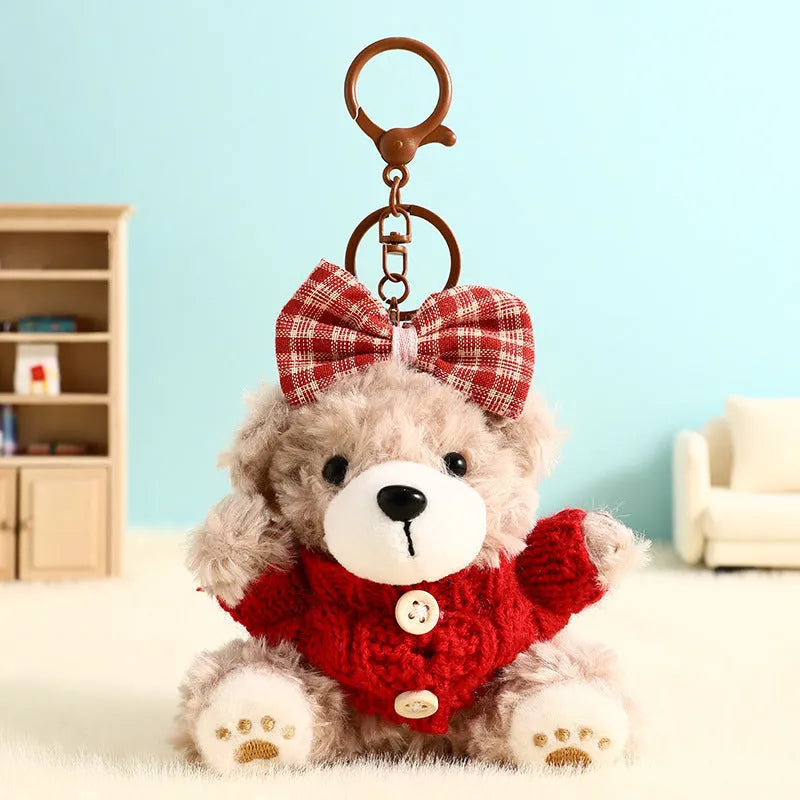 Plush biscuit bear keychain pendant with coloured bow on a soft teddy bear design
