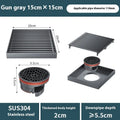 Gun grey 15cm square ABS plastic core sitting in a 304 stainless steel courtyard floor drain frame.