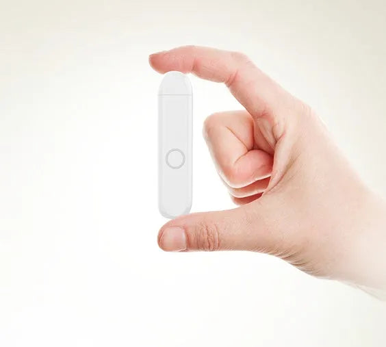 Compact black A1 Bluetooth audio receiver with 3.5mm plug shown in pendant wearing style.