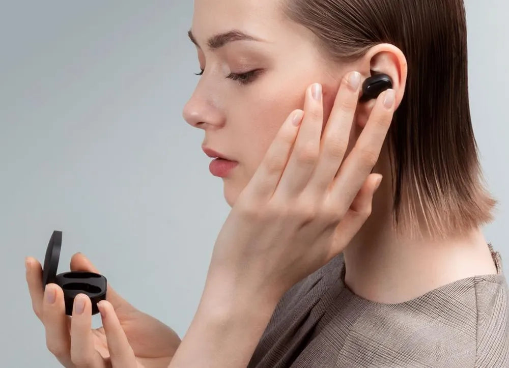 Redmi AirDots black true wireless Bluetooth headphones with charging case.