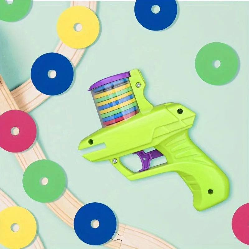 Interactive cat toy launcher in green or purple with foam discs for indoor play