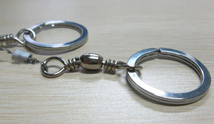 Outdoor survival wire saw with stainless steel blade, pull rings, and hoop showing 55cm cutting length