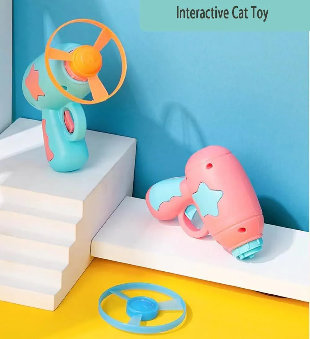 Blue plastic cat toy gun with spinning frisbee launch mechanism for indoor cats