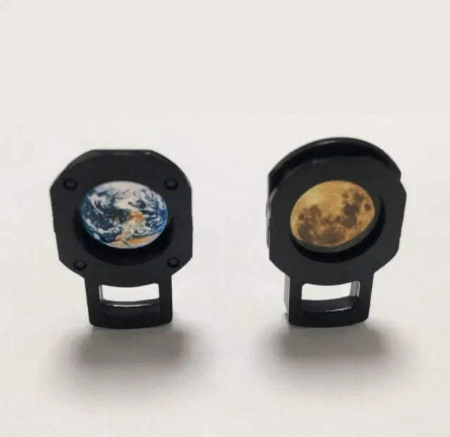 Earth and Moon projection lamp with adjustable metal hose bracket on a wooden table.