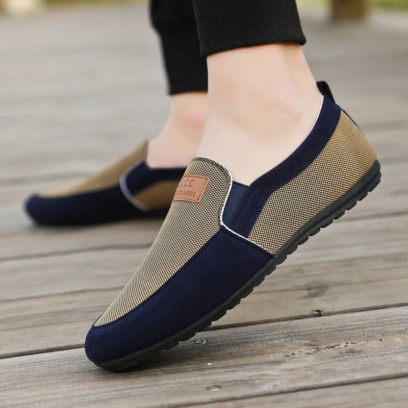 Men's grey and khaki canvas casual shoes with round toe and stitching detail.