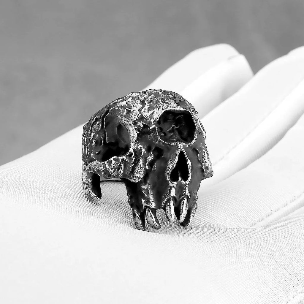 Alloy skull ring with one-eyed design and electroplated metallic finish shown on hand