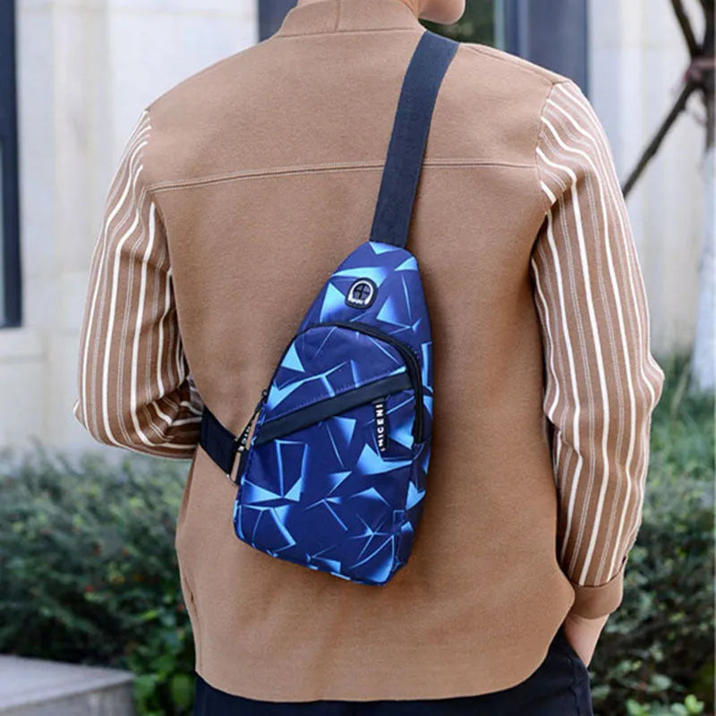 Black print sling chest crossbody bag with earphone hole and zipper pocket.