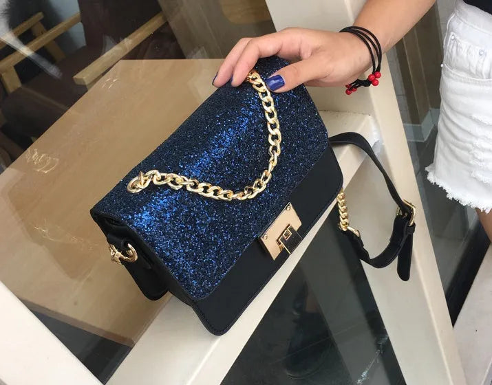 Women's small square sequined PU handbag with lock closure and adjustable shoulder strap in pink, wathet, and black colours 22x16x9cm