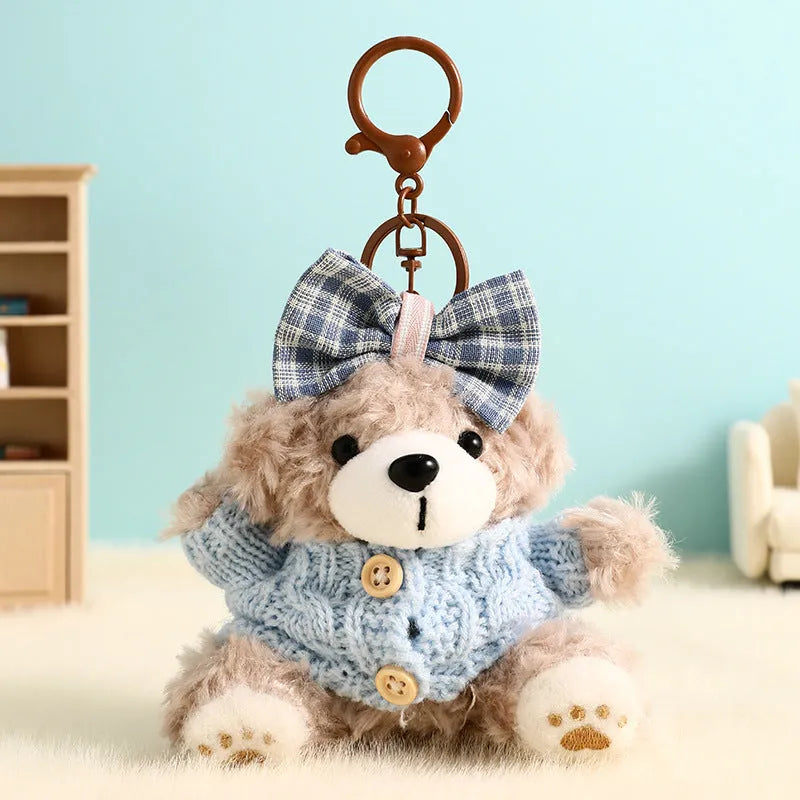 Plush biscuit bear keychain pendant with coloured bow on a soft teddy bear design