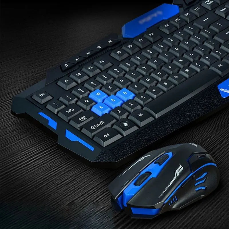 Black and blue wireless keyboard and mouse set on a desk showing its slim profile.