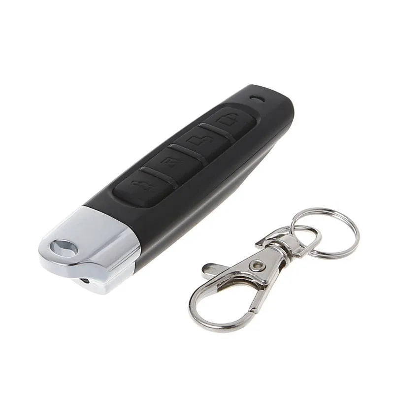 Rolling door remote control unit shown in black, with dimensions 6.7cm long.