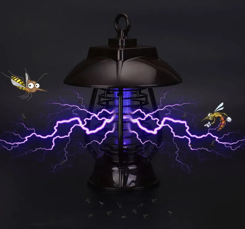 White and purple solar-powered electronic mosquito lamp for outdoor garden use.