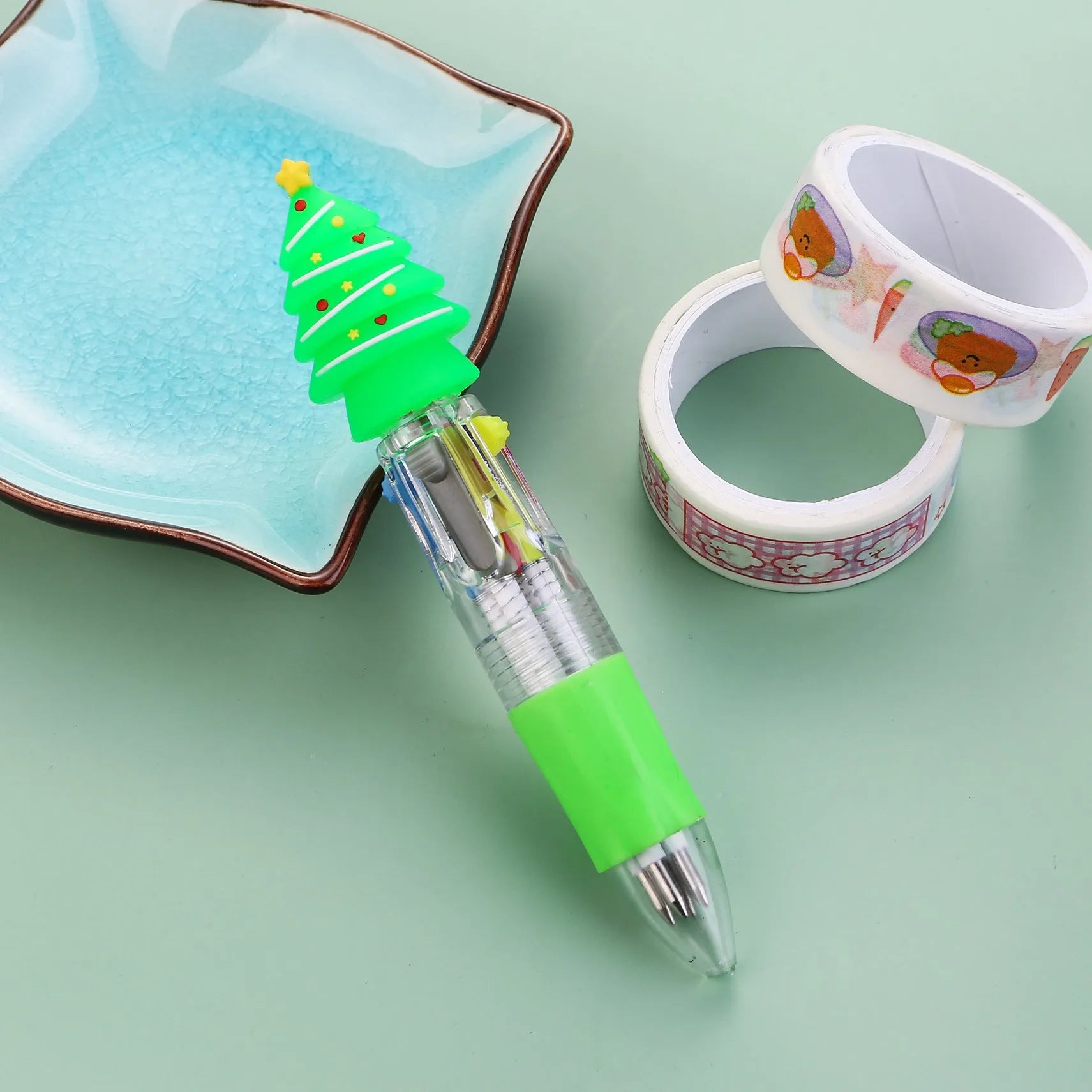 Christmas mini four-colour press-action ballpoint pen with festive designs measuring 11 cm.
